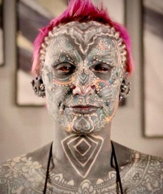 Army Vet breaks world record with having her body tattooed 99.9%, but